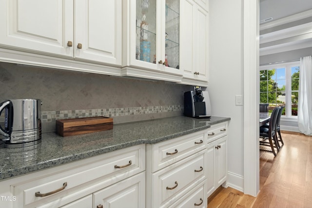 238 Michelangelo Way, Cary, NC 27518 - bar area featuring light wood-type flooring and tasteful backsplash