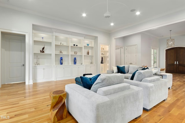 238 Michelangelo Way, Cary, NC 27518 - living area featuring ornamental molding, light wood finished floors, built in shelves, and recessed lighting