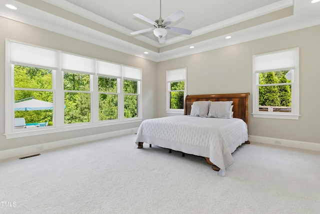238 Michelangelo Way, Cary, NC 27518 - carpeted bedroom with a raised ceiling, multiple windows, baseboards, recessed lighting, and ornamental molding