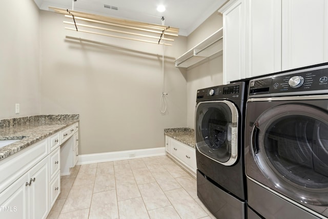 238 Michelangelo Way, Cary, NC 27518 - washroom with washing machine and clothes dryer, baseboards, cabinet space, and light tile patterned flooring