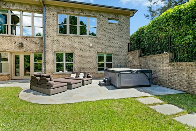 238 Michelangelo Way, Cary, NC 27518 - rear view of property featuring a hot tub, a patio, french doors, and brick siding