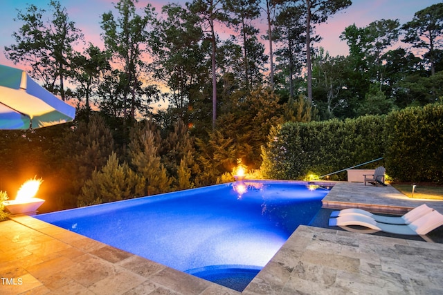 238 Michelangelo Way, Cary, NC 27518 - pool at dusk featuring a patio