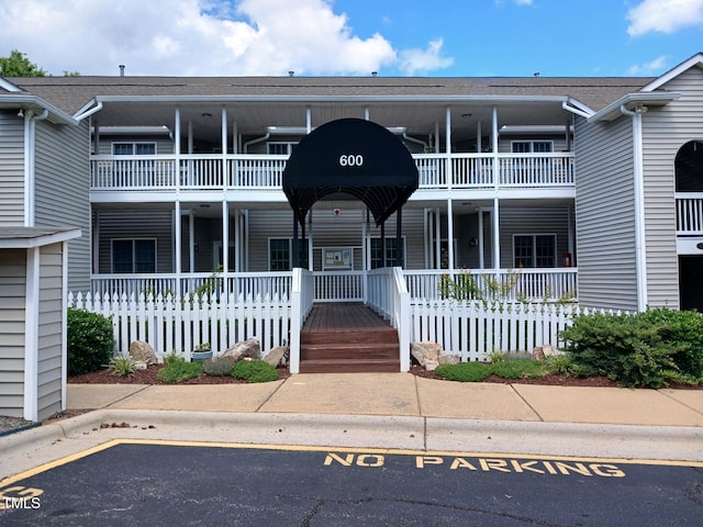 631 Springfork Dr, Cary, NC 27513 - view of building exterior with uncovered parking