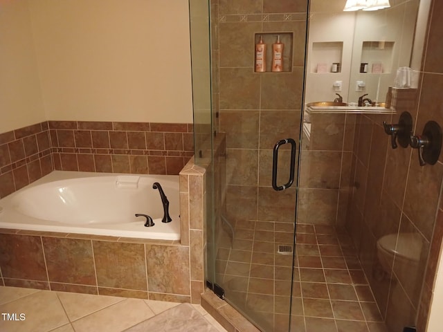 631 Springfork Dr, Cary, NC 27513 - full bath featuring a garden tub, a stall shower, tile patterned flooring, and toilet