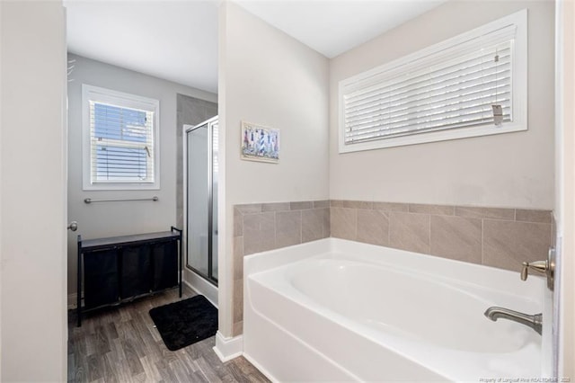 7680 Rufus Johnson Rd, Fayetteville, NC 28306 - full bath featuring a bath, a stall shower, and wood finished floors