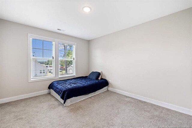 7680 Rufus Johnson Rd, Fayetteville, NC 28306 - carpeted bedroom with baseboards and recessed lighting