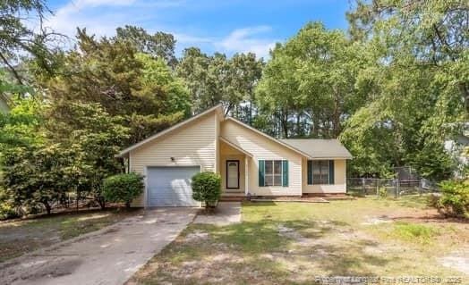 7076 Pantego Dr, Fayetteville, NC 28314 - view of front facade with an attached garage and concrete driveway