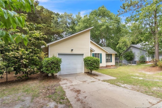 7076 Pantego Dr, Fayetteville, NC 28314 - view of front facade with driveway and an attached garage
