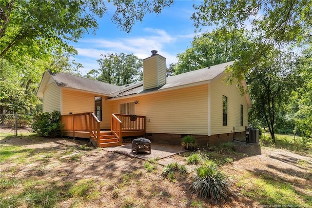 7076 Pantego Dr, Fayetteville, NC 28314 - rear view of property with an outdoor fire pit, crawl space, a deck, central air condition unit, and a chimney