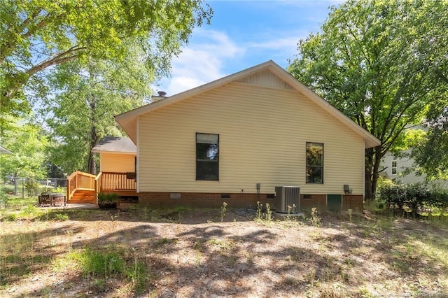 7076 Pantego Dr, Fayetteville, NC 28314 - rear view of property featuring crawl space, central AC, and a wooden deck