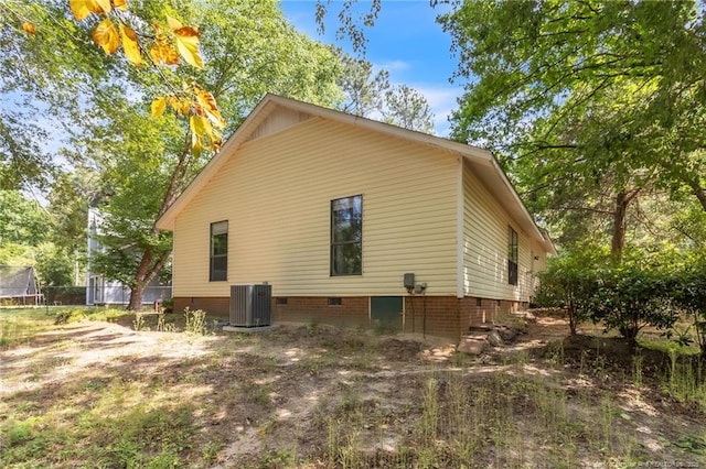 7076 Pantego Dr, Fayetteville, NC 28314 - view of property exterior featuring central AC unit, crawl space, and a trampoline