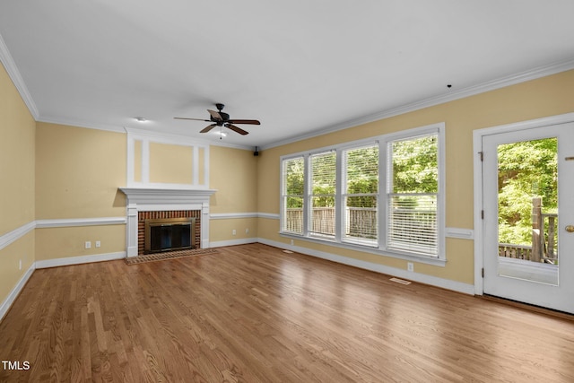 100 Silver Lining Ln, Cary, NC 27513 - unfurnished living room with a ceiling fan, baseboards, ornamental molding, a fireplace, and wood finished floors