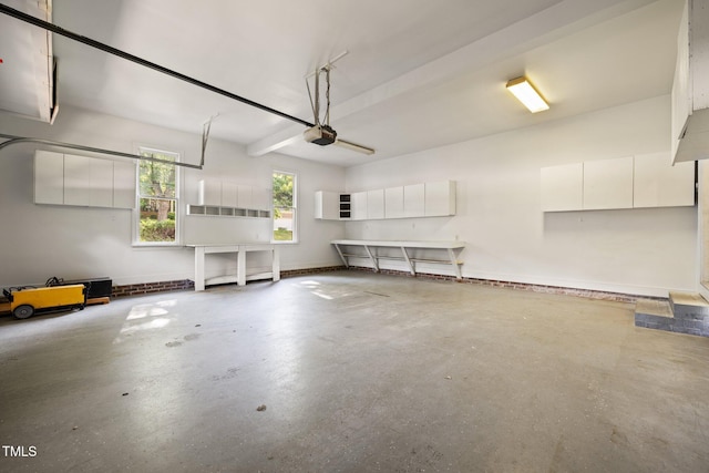 100 Silver Lining Ln, Cary, NC 27513 - garage featuring a garage door opener and baseboards