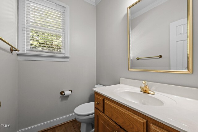 100 Silver Lining Ln, Cary, NC 27513 - half bathroom with vanity, toilet, wood finished floors, and baseboards
