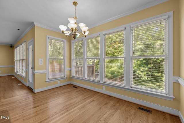 100 Silver Lining Ln, Cary, NC 27513 - unfurnished dining area featuring a chandelier, light wood-type flooring, crown molding, and baseboards