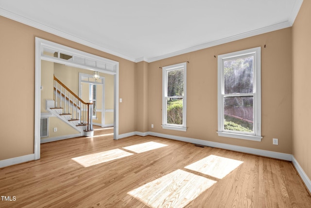 100 Silver Lining Ln, Cary, NC 27513 - spare room featuring crown molding, stairs, baseboards, and wood finished floors