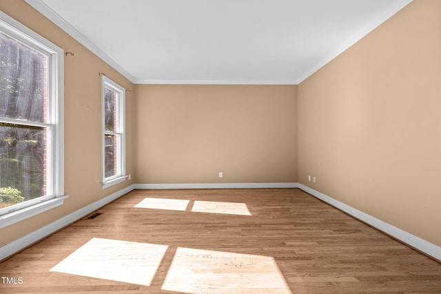 100 Silver Lining Ln, Cary, NC 27513 - spare room with ornamental molding, baseboards, and wood finished floors