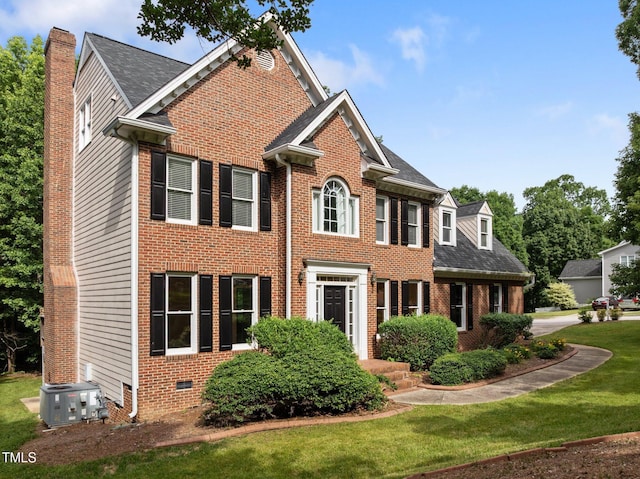 100 Silver Lining Ln, Cary, NC 27513 - georgian-style home with brick siding, a front yard, central AC unit, and crawl space