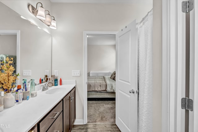 6760 Longitude Cir, Sims, NC 27880 - full bathroom featuring vanity, ensuite bath, wood finished floors, and baseboards