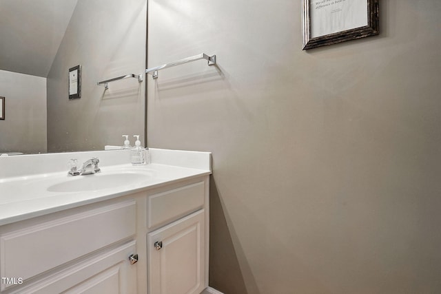 4907 Wyatt Brook Way, Raleigh, NC 27609 - bathroom with lofted ceiling and vanity