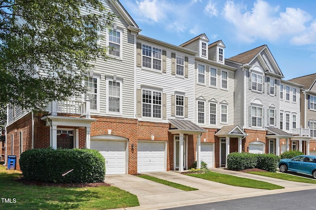 4907 Wyatt Brook Way, Raleigh, NC 27609 - multi unit property with brick siding, a garage, driveway, and a residential view