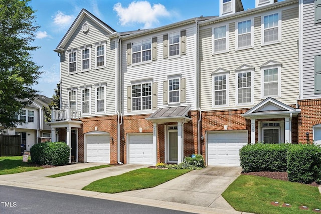 4907 Wyatt Brook Way, Raleigh, NC 27609 - view of property featuring brick siding, driveway, and a garage