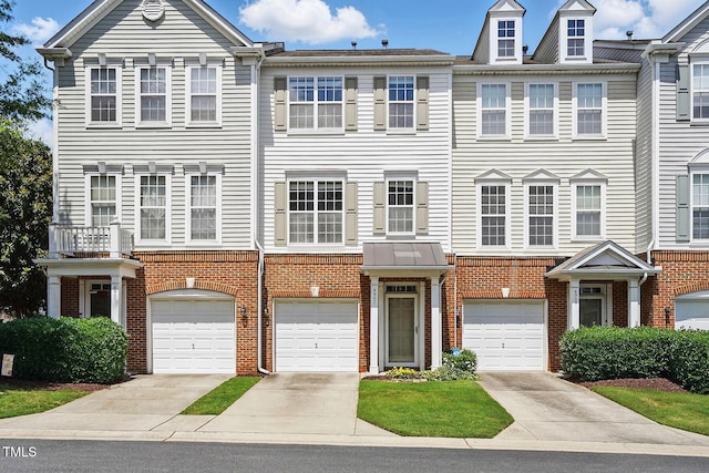 4907 Wyatt Brook Way, Raleigh, NC 27609 - view of property featuring brick siding, driveway, and an attached garage