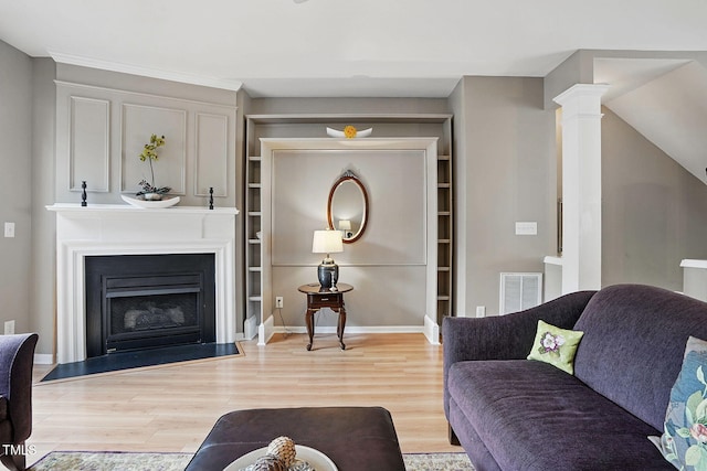 4907 Wyatt Brook Way, Raleigh, NC 27609 - living area with light wood-style flooring, a fireplace, and baseboards