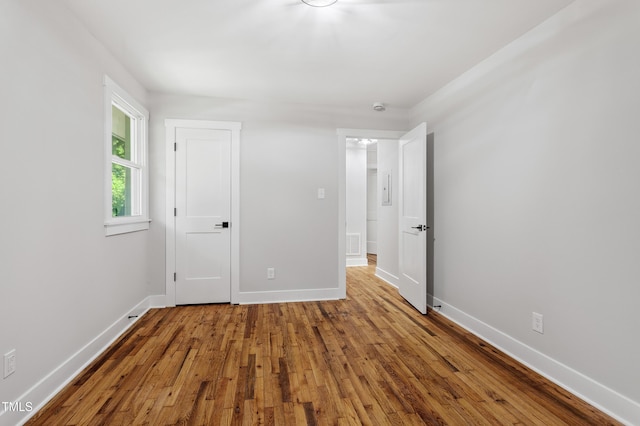 833 Brigham Rd, Raleigh, NC 27610 - unfurnished bedroom with wood-type flooring and baseboards