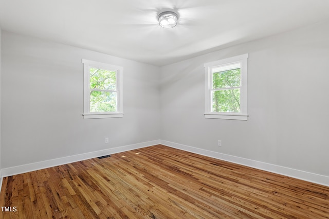 833 Brigham Rd, Raleigh, NC 27610 - spare room featuring healthy amount of natural light, baseboards, and wood finished floors