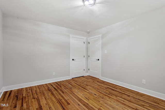 833 Brigham Rd, Raleigh, NC 27610 - empty room with baseboards and wood finished floors