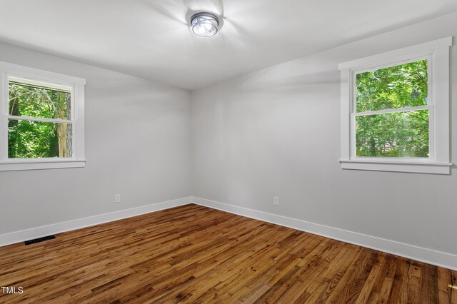 833 Brigham Rd, Raleigh, NC 27610 - spare room featuring baseboards and wood finished floors