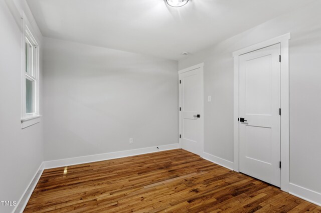 833 Brigham Rd, Raleigh, NC 27610 - spare room featuring wood finished floors and baseboards
