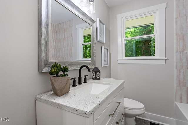 833 Brigham Rd, Raleigh, NC 27610 - full bath with vanity, toilet, and tile patterned floors