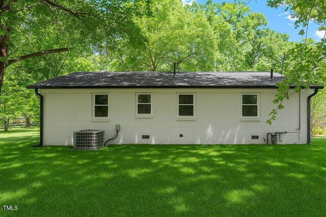 833 Brigham Rd, Raleigh, NC 27610 - rear view of house with a yard, central air condition unit, and crawl space