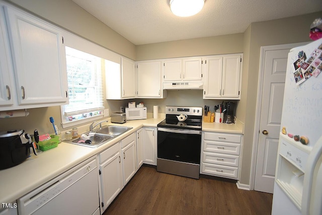 1910 Trexler Ct, Raleigh, NC 27606 - kitchen with white appliances, under cabinet range hood, a sink, white cabinetry, and a textured ceiling