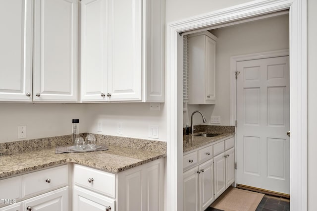 81002 Alexander, Chapel Hill, NC 27517 - kitchen featuring white cabinetry and light stone countertops