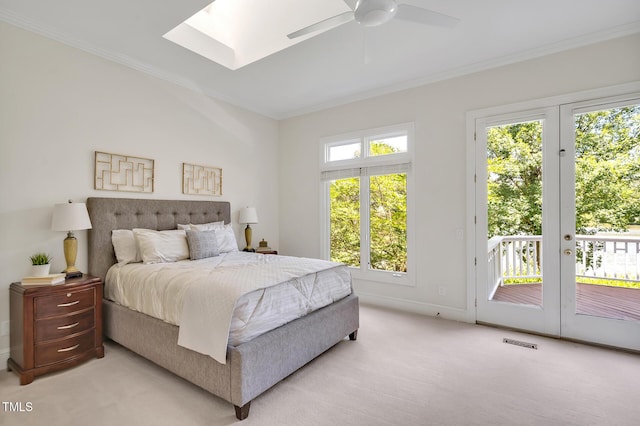 81002 Alexander, Chapel Hill, NC 27517 - bedroom featuring access to exterior, ornamental molding, light colored carpet, a skylight, and ceiling fan