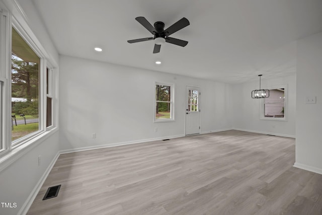 111 S Gaylee Lake Dr, Wendell, NC 27591 - unfurnished room featuring a chandelier, baseboards, light wood-style floors, ceiling fan, and recessed lighting