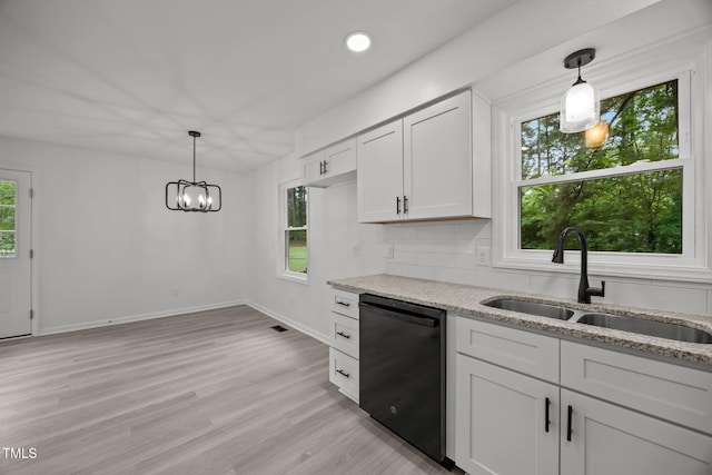 111 S Gaylee Lake Dr, Wendell, NC 27591 - kitchen with dishwasher, a sink, healthy amount of natural light, light stone countertops, and recessed lighting