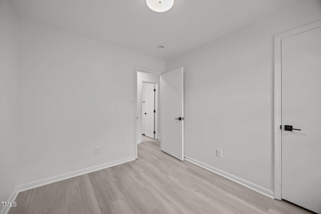 111 S Gaylee Lake Dr, Wendell, NC 27591 - unfurnished bedroom featuring light wood-style flooring and baseboards