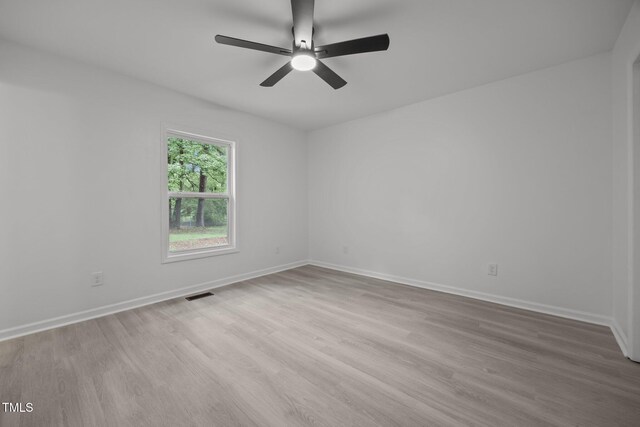 111 S Gaylee Lake Dr, Wendell, NC 27591 - empty room with wood finished floors, a ceiling fan, and baseboards