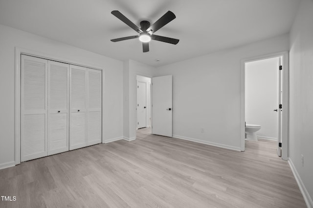 111 S Gaylee Lake Dr, Wendell, NC 27591 - unfurnished bedroom featuring light wood finished floors, baseboards, a closet, and ensuite bathroom