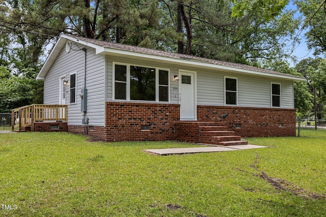 111 S Gaylee Lake Dr, Wendell, NC 27591 - view of front facade with crawl space, brick siding, and roof with shingles