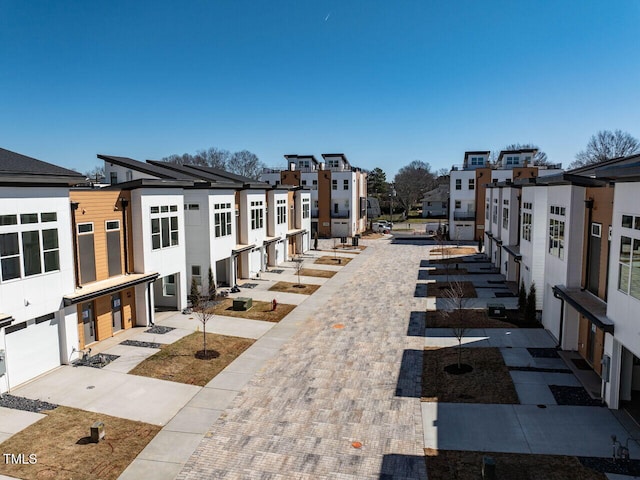 1408 Sawyer Rd Unit 103, Raleigh, NC 27610 - view of home's community with a residential view, driveway, and a garage