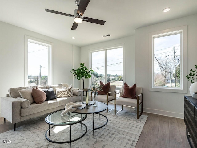 1408 Sawyer Rd Unit 103, Raleigh, NC 27610 - living area with healthy amount of natural light, baseboards, wood finished floors, a ceiling fan, and recessed lighting