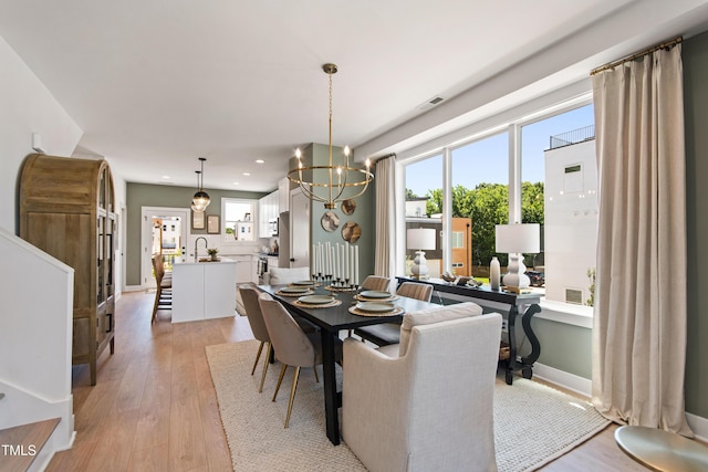 1408 Sawyer Rd Unit 103, Raleigh, NC 27610 - dining room featuring recessed lighting, light wood-type flooring, and a chandelier