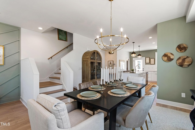 1408 Sawyer Rd Unit 103, Raleigh, NC 27610 - dining room featuring a chandelier, light wood-type flooring, stairs, and recessed lighting