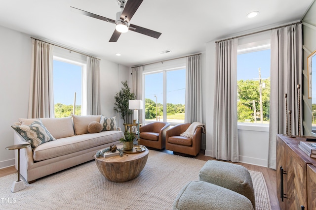 1408 Sawyer Rd Unit 103, Raleigh, NC 27610 - living area with light wood-style flooring, ceiling fan, plenty of natural light, and recessed lighting