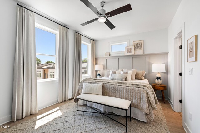 1408 Sawyer Rd Unit 103, Raleigh, NC 27610 - bedroom featuring light wood-type flooring and a ceiling fan